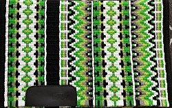 SOLD- Black base with greens and white accents $195