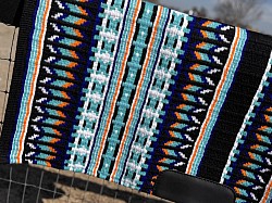 Black base with oranges, teal, blue and white accents $195